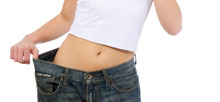 Our comprehensive weight loss program will get you into shape. woman wearing pants that are too large